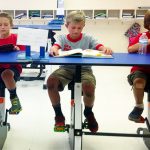 student-cycling-while-learning