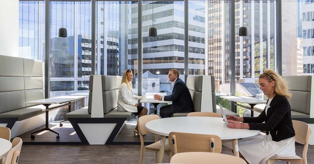 staff in a meeting with good office fitout office setting